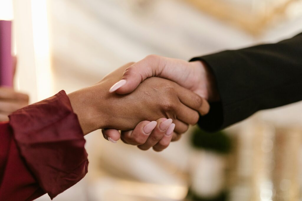 pexels photo 8069744 8069744 Close-up of two professionals shaking hands, symbolizing agreement and partnership.